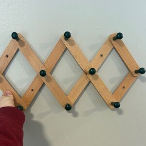 Expandable Wooden Wall Rack with Black Accents, accordion style